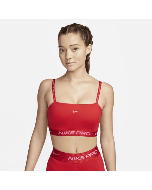 Nike Pro Indy Lightsupport Padded Bandeau Sports Bra In Red, Lyst