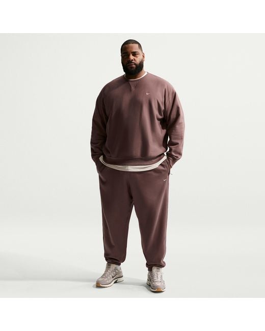 Nike Red Solo Swoosh Cuffed Fleece Pants for men