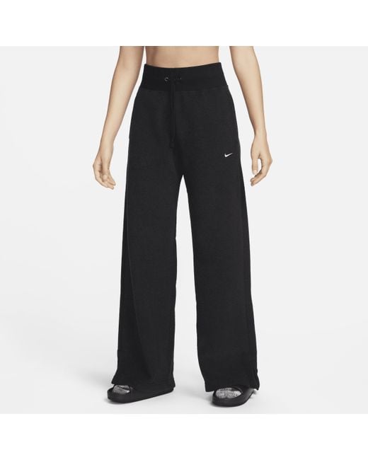 Pantaloni confortevoli in fleece a gamba larga e vita alta sportswear phoenix plush di Nike in Black