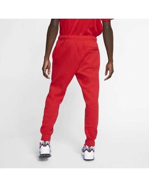 red nike club joggers
