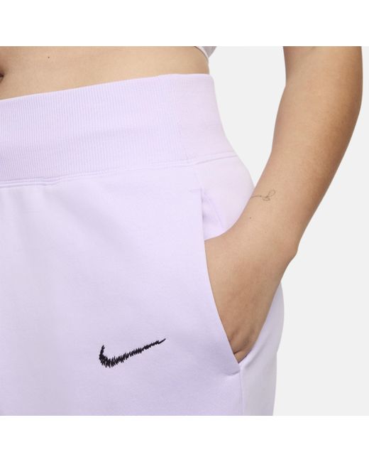 Pantaloni curve da calcio a vita alta inghilterra phoenix fleece di Nike in Purple