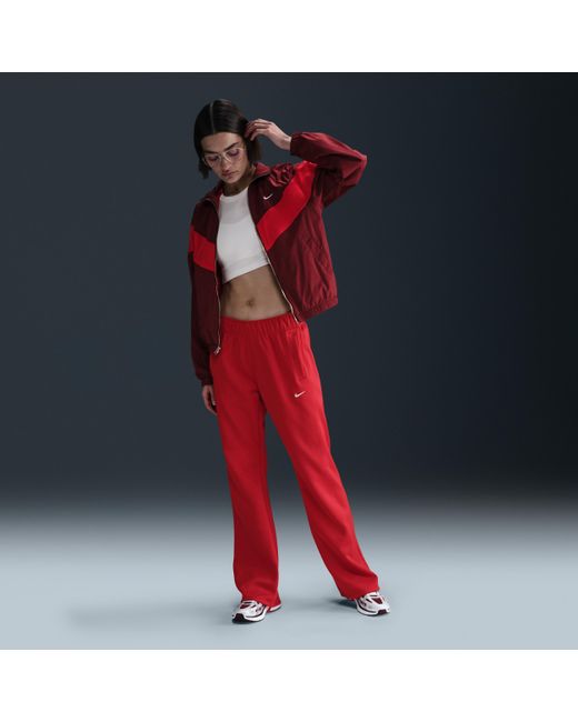 Nike Sportswear Windrunner Mid-Rise Slim Knit Pants in Red