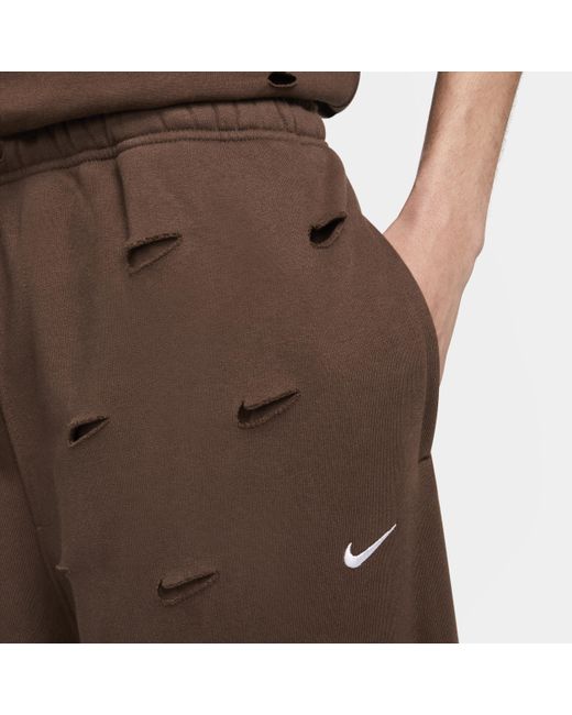 Pantaloni con swoosh x jacquemus di Nike in Brown