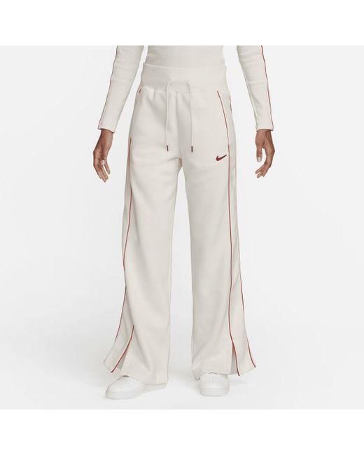 Pantaloni tuta a vita alta con orlo aperto sportswear phoenix fleece di Nike in White