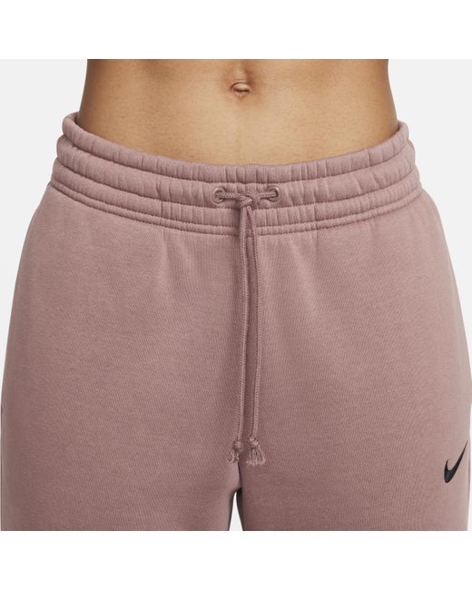 Pantaloni tuta a vita media sportswear phoenix fleece di Nike in Pink