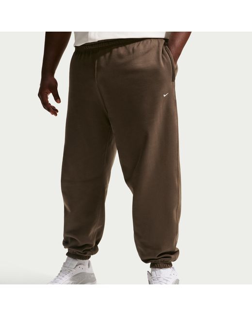 Nike Black Solo Swoosh Cuffed Fleece Pants for men