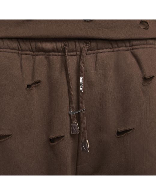 Pantaloni con swoosh x jacquemus di Nike in Brown