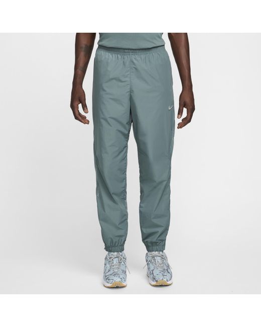 Nike nrg track pant light smoke grey hotsell