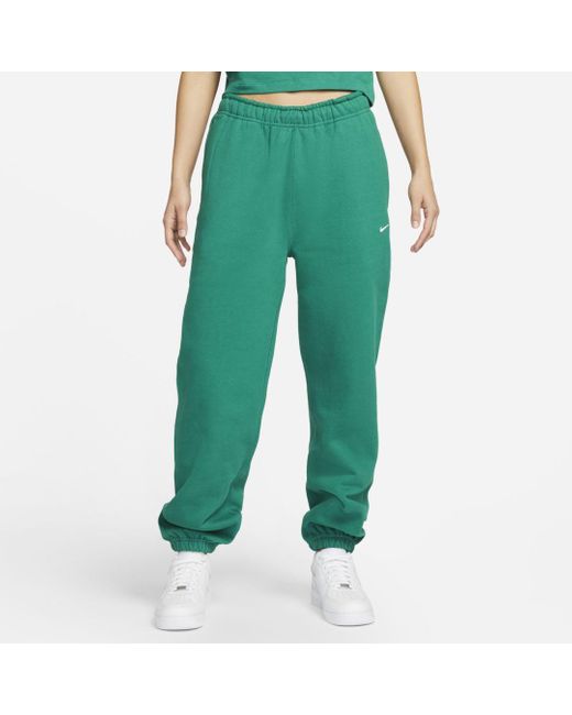 Nike Solo Swoosh Fleece Pants in Green - Lyst