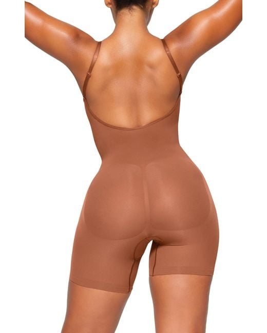 Skims Seamless Sculpt Low Back Thong Bodysuit in Brown