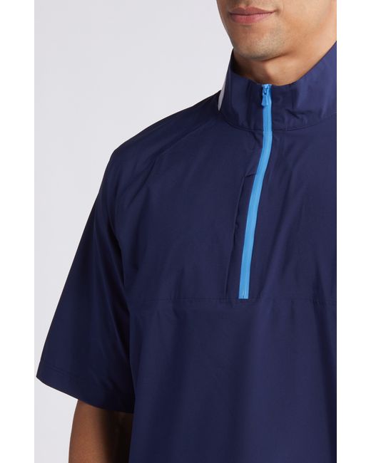 Johnnie-o Blue Stealth Stowable Short Sleeve Pullover Rain Jacket for men
