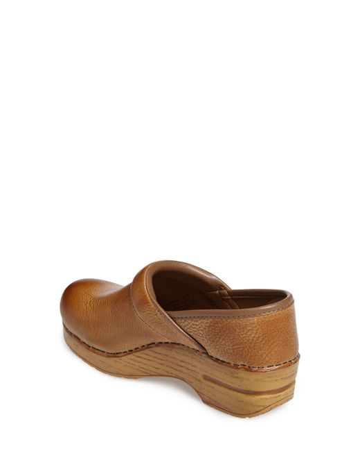 dansko honey distressed clogs