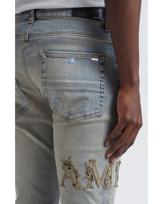 Amiri Blue Baroque Logo Distressed Nonstretch Denim Jeans for men