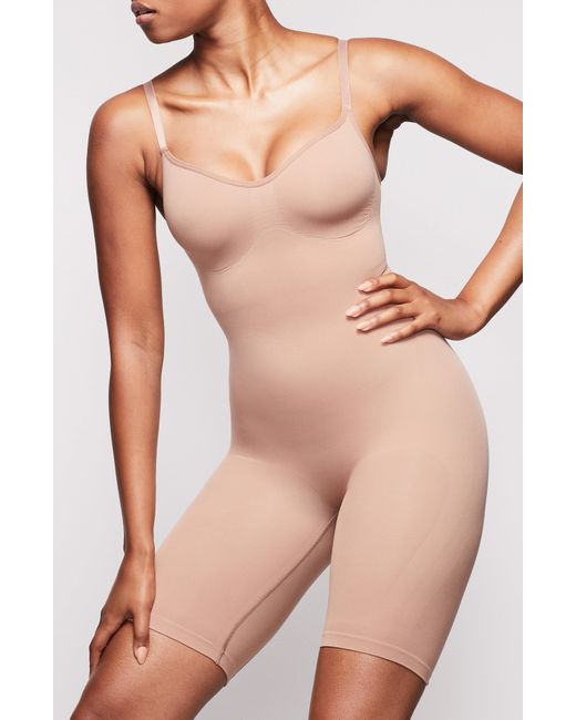 Skims Sculpting Seamless Midthigh Bodysuit in Natural Lyst