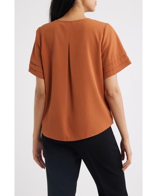 Anne Klein Orange Pleated Split Neck Top