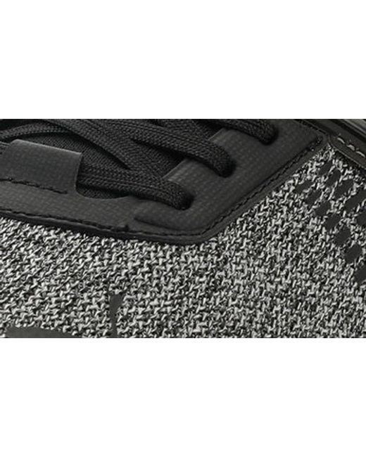 PUMA Black Outpace Heather Sneaker for men