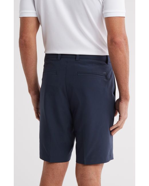 Greg Norman Blue Flat Front Golf Shorts for men