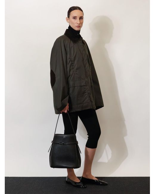 Totême Black Hammered Leather Bucket Bag With Strap On The Front