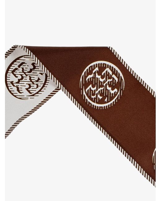 Cravatta Medallion Logo Ribbon Tie di Tory Burch in Brown