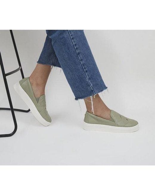 green slip on trainers