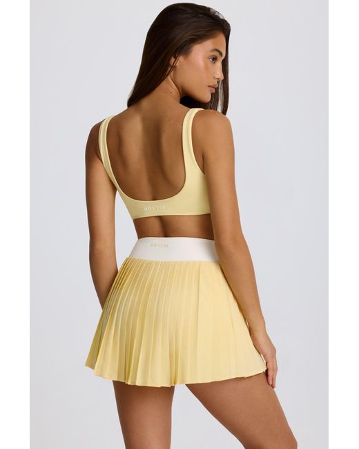 BO+TEE Yellow Soft Active Crossover Pleated Mini Skort