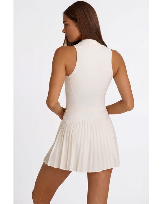 BO+TEE White Soft Active Crossover Pleated Mini Skort