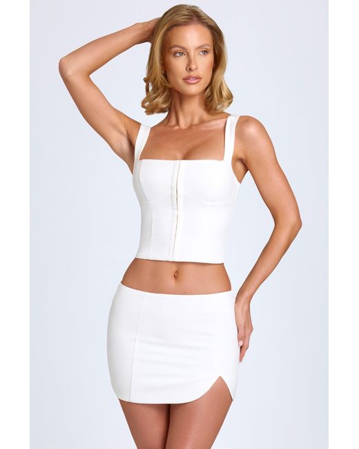 Oh Polly White Curved Low-Rise Mini Skirt