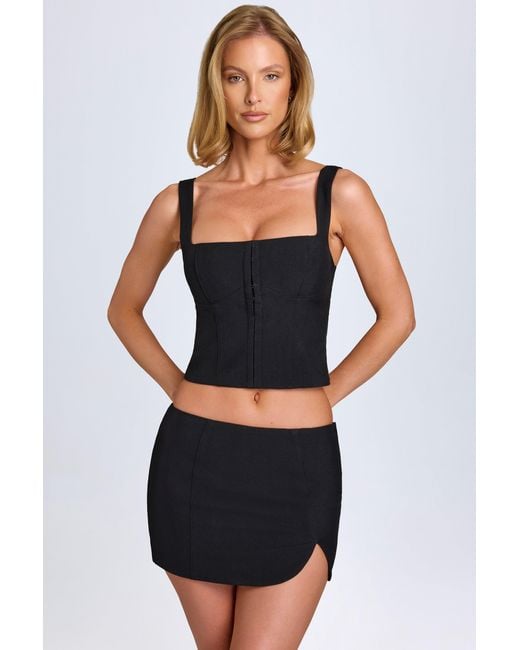 Oh Polly Black Curved Low-Rise Mini Skirt