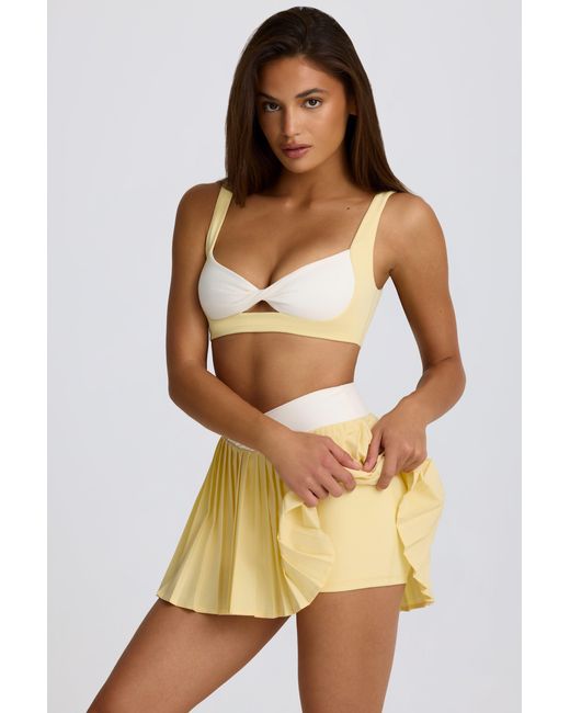 BO+TEE Yellow Soft Active Crossover Pleated Mini Skort