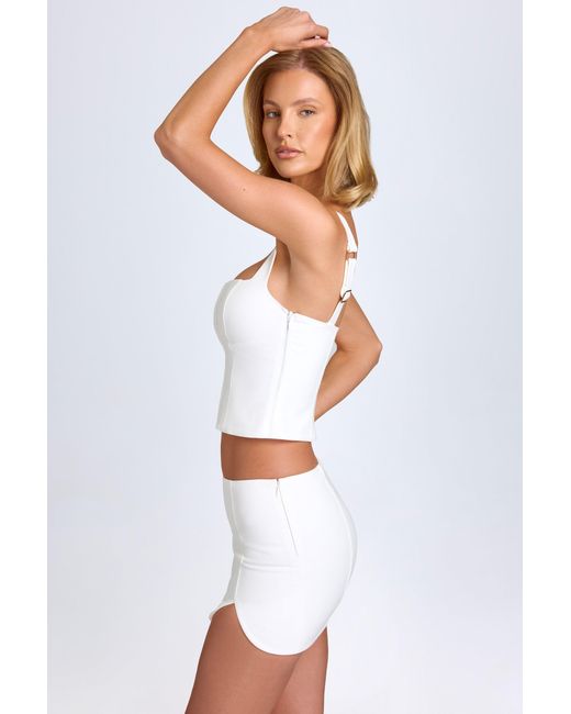 Oh Polly White Curved Low-Rise Mini Skirt