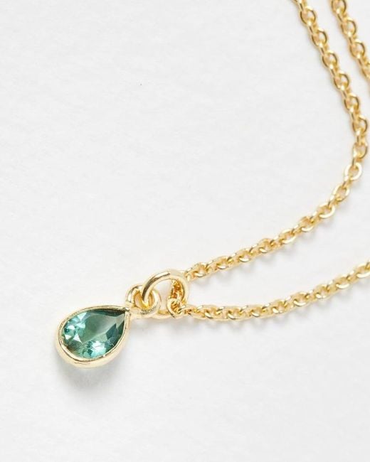 https://cdna.lystit.com/520/650/n/photos/oliverbonas/0c2cea18/oliver-bonas-Green-Auden-Tourmaline-Gold-Plated-Pendant-Necklace.jpeg