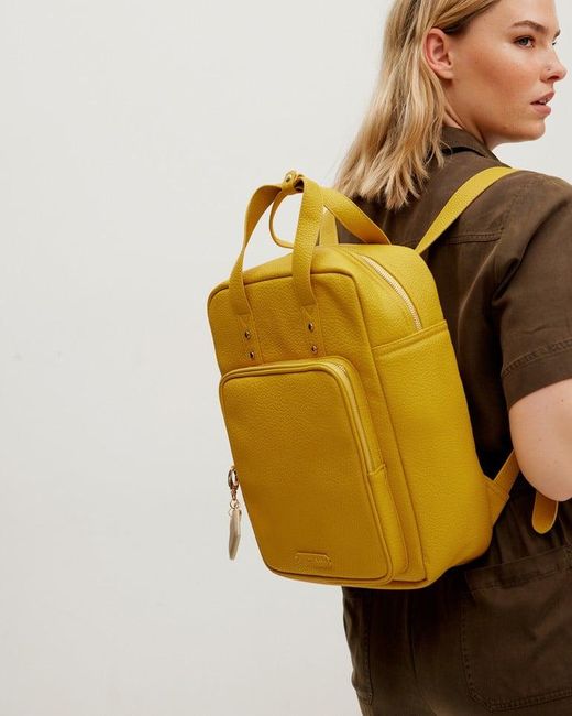 Oliver Bonas Mami Laptop Backpack in Yellow Lyst