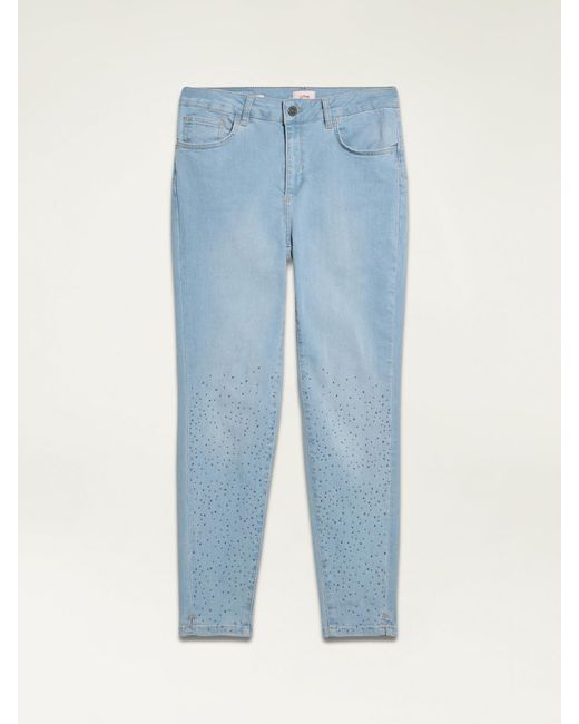 Jeans skinny eco-friendly stone bleached con borchiette di Oltre in Natural