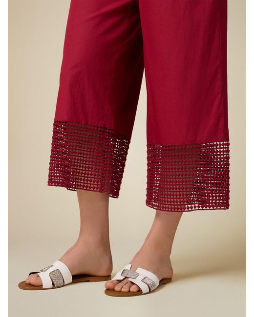 Pantaloni cropped con inserti in macramé di Oltre in Red