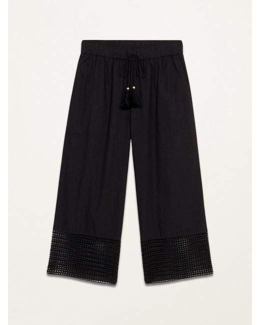Pantaloni cropped con inserti in macramé di Oltre in Black