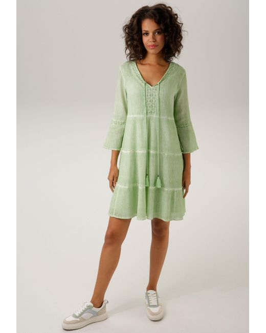 Aniston CASUAL Tunikakleid ( Jersey-Unterkleid) mit aufwändiger  Spitzenverzierung in Grün | Lyst DE