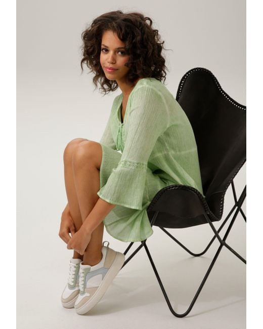 Aniston CASUAL Tunikakleid ( Spitzenverzierung mit Jersey-Unterkleid) | Lyst Grün aufwändiger in DE