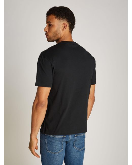 Calvin Klein OFF PLACEMENT LOGO T-SHIRT mit Logoschriftzug in Black für Herren