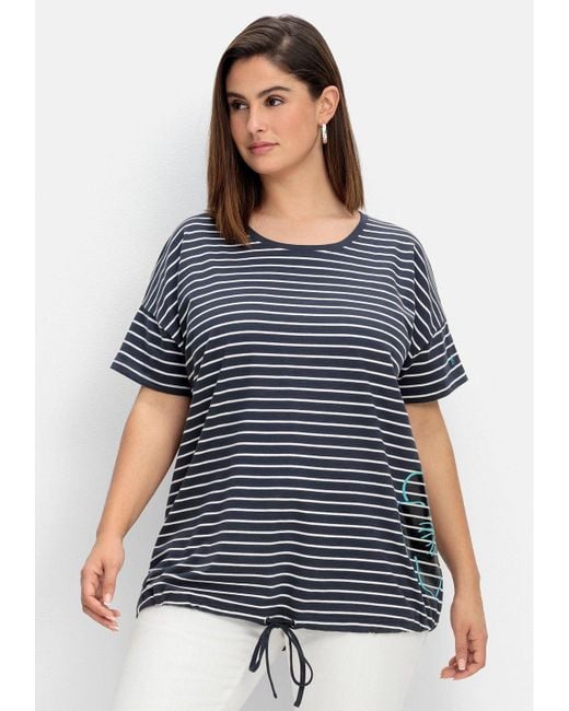Sheego T-Shirt Große Größen mit Saum-Bindeband und Druck seitlich in Blau |  Lyst DE