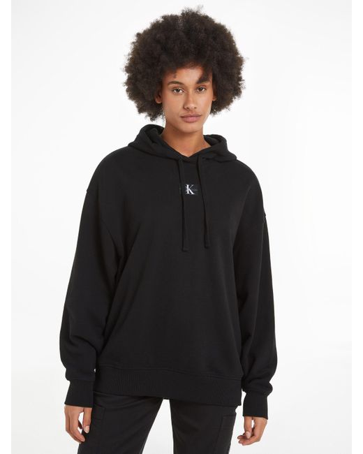 Calvin Klein Black Longsweatshirt WOVEN LABEL OVERSIZED HOODIE mit Logopatch