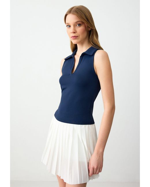 Jimmy Key Blue Blusentop Marineblaue Ärmellose Polobluse