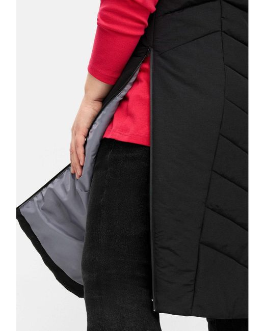 Sheego Black Longweste Große Größen mit Kapuze und seitlichen Zippern, wasserabweisend