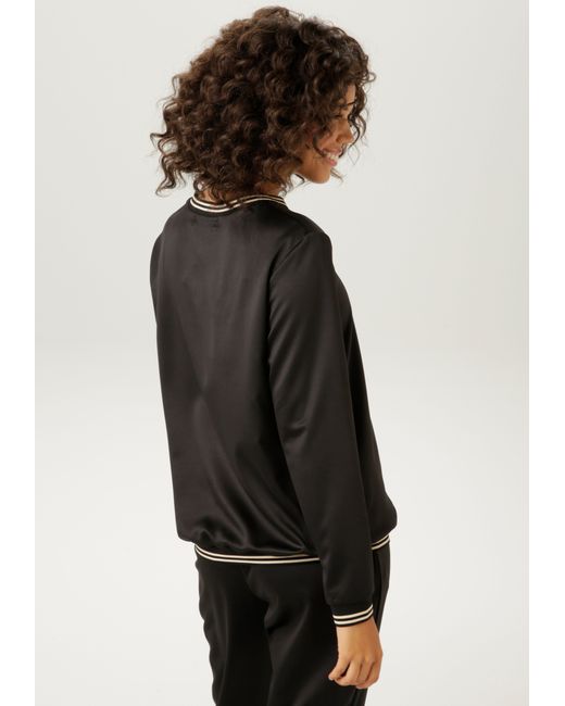 Aniston CASUAL Black Shirtbluse mit gestreiften Bündchen an den Abschlüssen