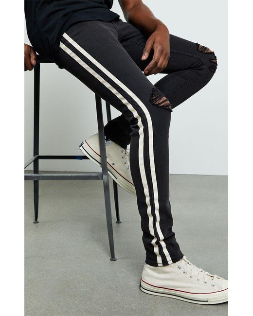 Side Stripe Ripped Stacked Skinny Jeans 