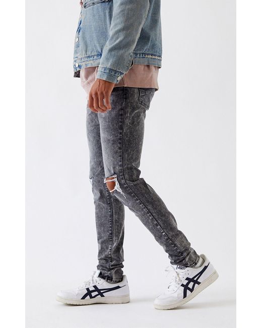 ripped stacked skinny jeans