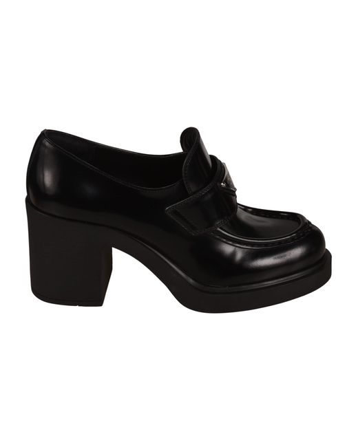 Womens Shoes Flats and flat shoes Loafers and moccasins Prada Leather Logo-plaque Heeled Loafers in Black 