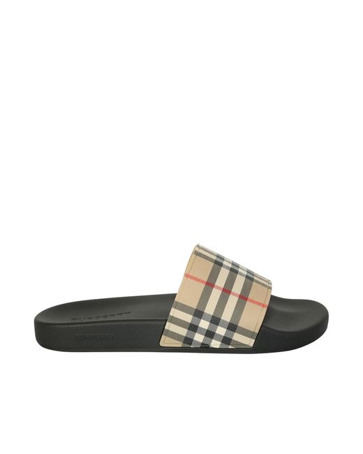 Burberry Contemporary, Cool And Vintage For The Checked Logo. Pool Slides Give A Casual Touch To