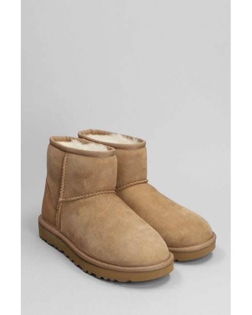 UGG Classic Mini Ii Sheepskin Boots in Brown | Lyst
