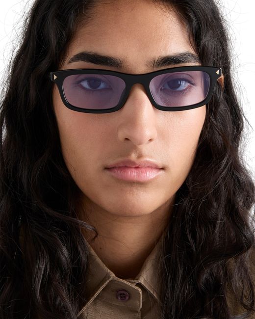 Prada White Sunglasses With The Iconic Metal Plaque