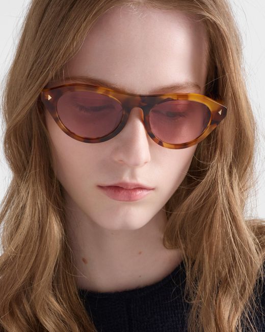 Prada Pink Sunglasses With The Iconic Metal Plaque